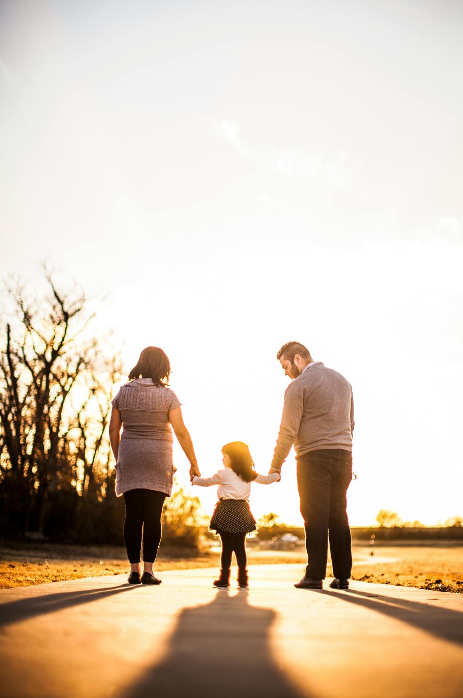 Family walking together at sunset